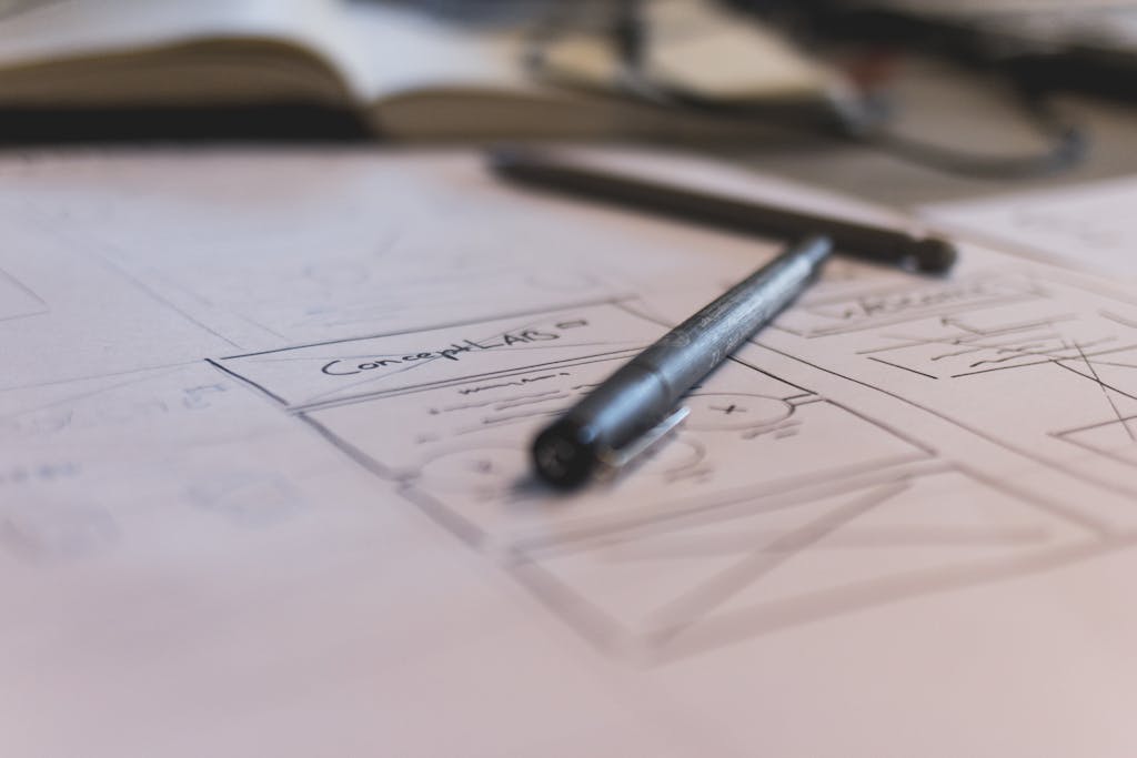 A sketch with notes and a pen on paper. Ideal for planning or design concepts.